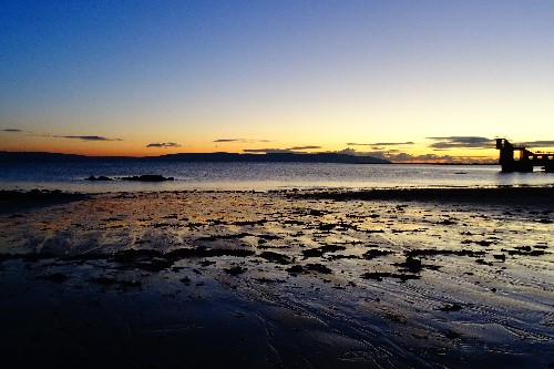 Gold & blue reflections from the sand on the beach