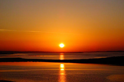 Exotic sunrise captured from the top of a hill over Galway city
