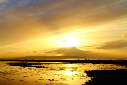 Deep yellow glistening on the ocean